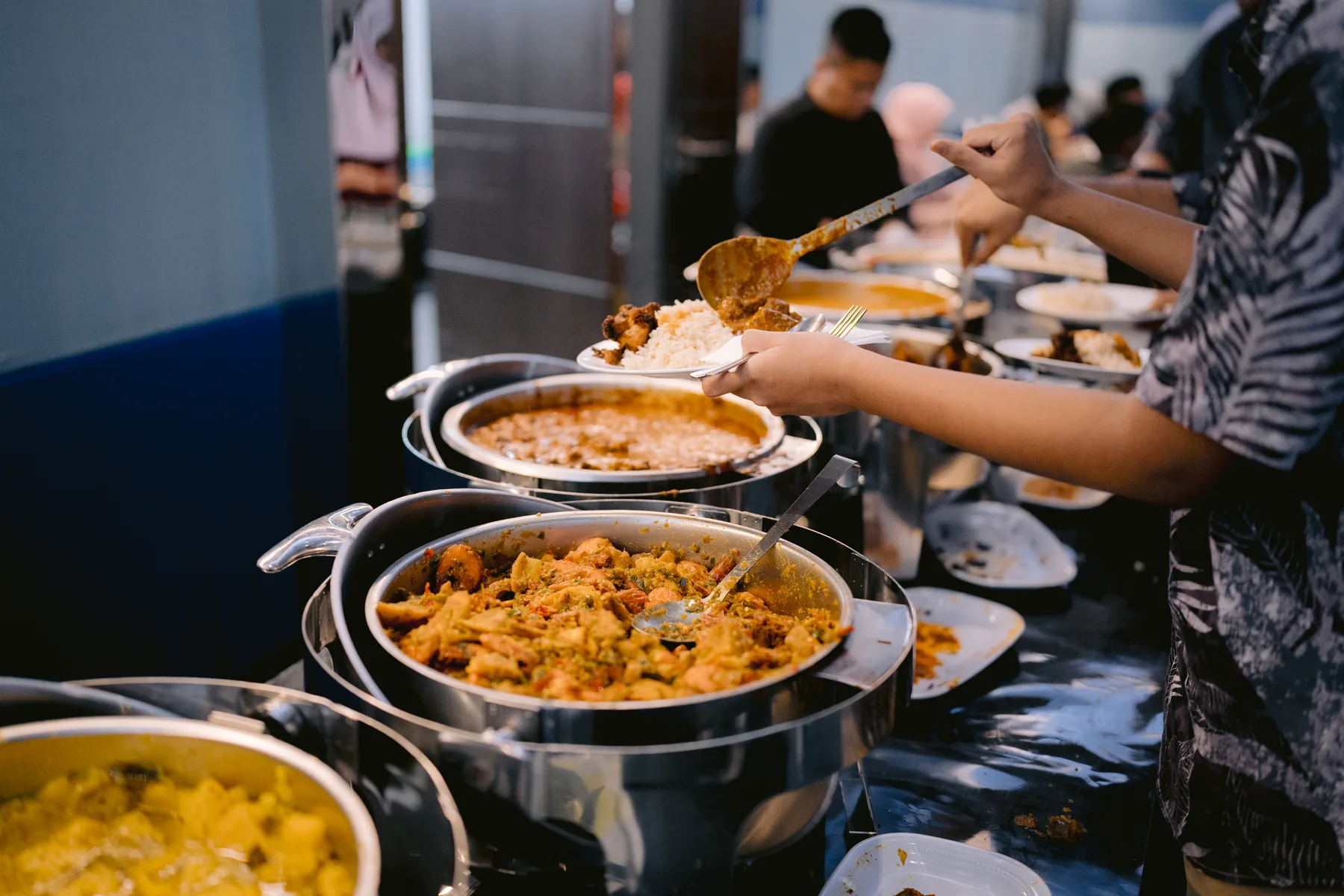 Guests being served from the catered buffet