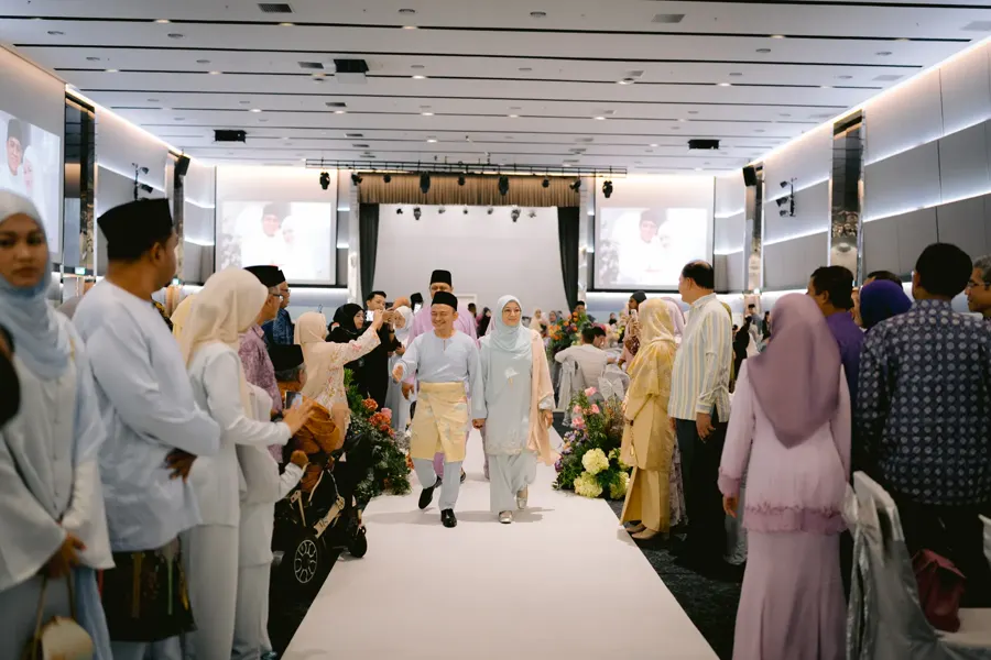 Family members entering a wedding celebration