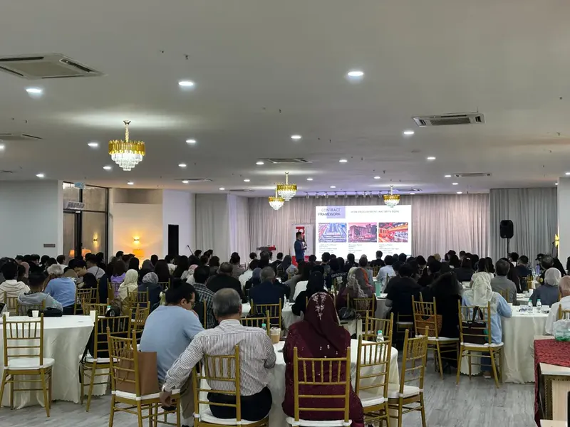 A conference audience seated inside Luminare Main Hall